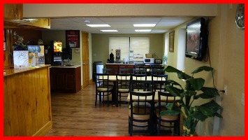 Seating area for breakfast area at Econo Lodge Inn & Suites