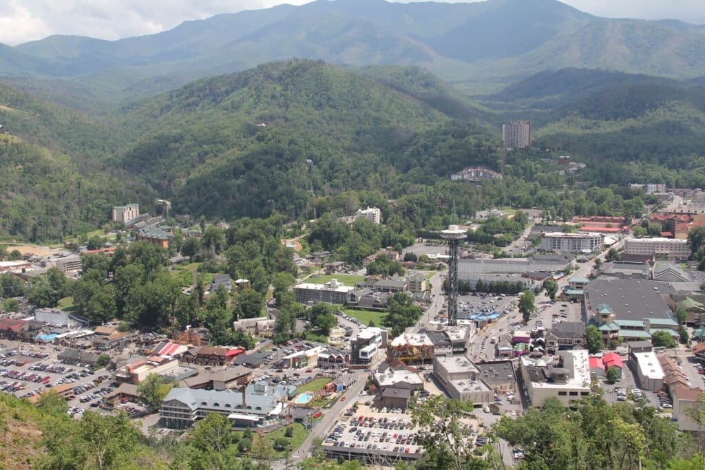 Overlook view of Gatlinburg Tennessee with the Parkway and Smoky Mountains in the background