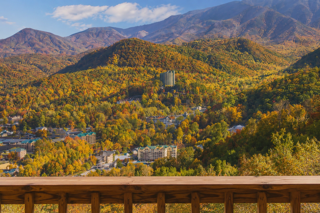 Luxury Cabins in Gatlinburg: The Ultimate Smoky Mountain Escape for Comfort, Views & Relaxation 2 View of the Smoky Mountains from a luxury cabin deck in Gatlinburg during fall